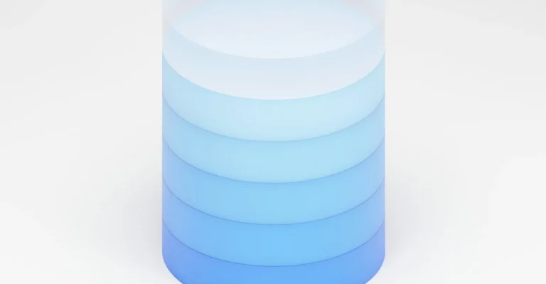 Rendu 3D d'un cylindre empilé en dégradé de bleu, symbole d'une base de données, illustration d'un cours SQL débutant
