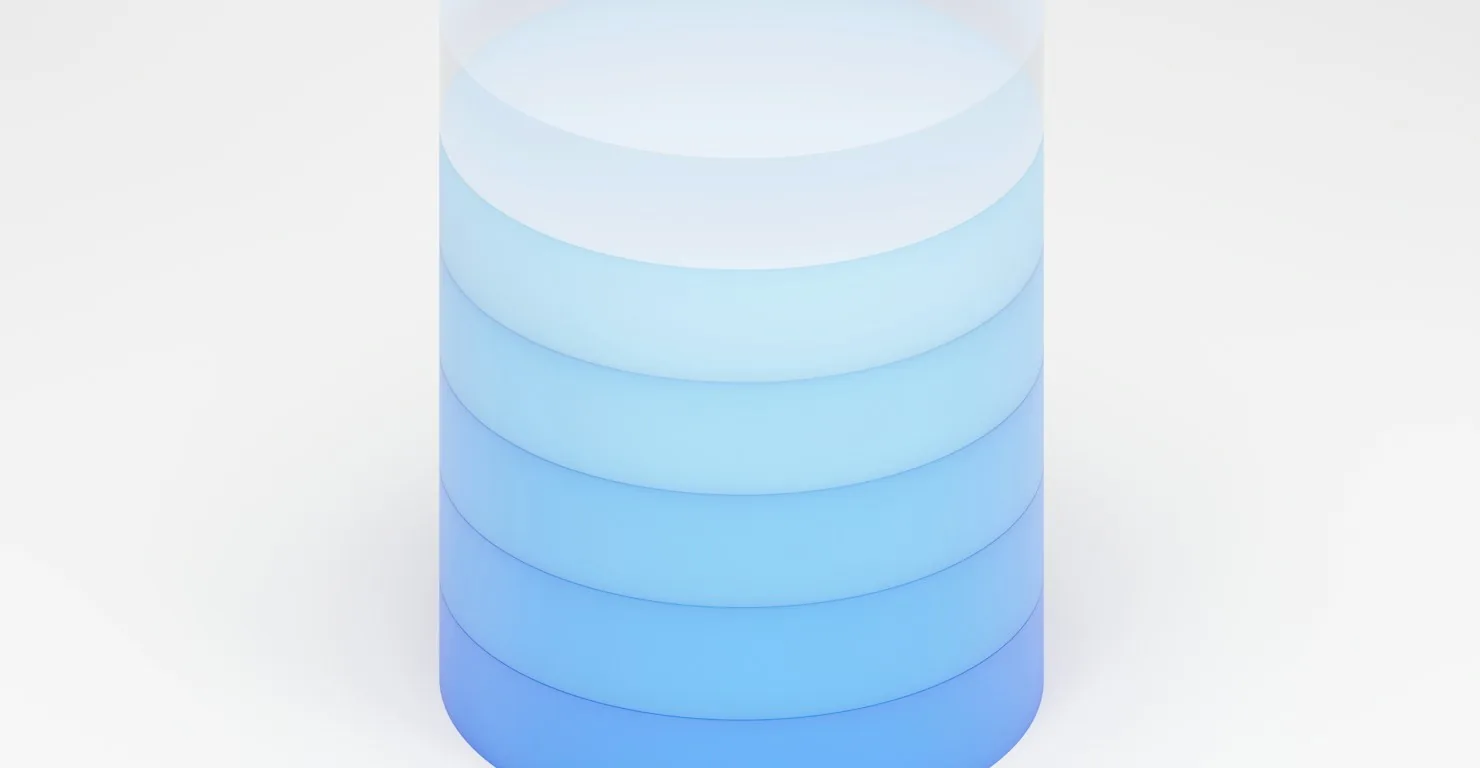 Rendu 3D d'un cylindre empilé en dégradé de bleu, symbole d'une base de données, illustration d'un cours SQL débutant
